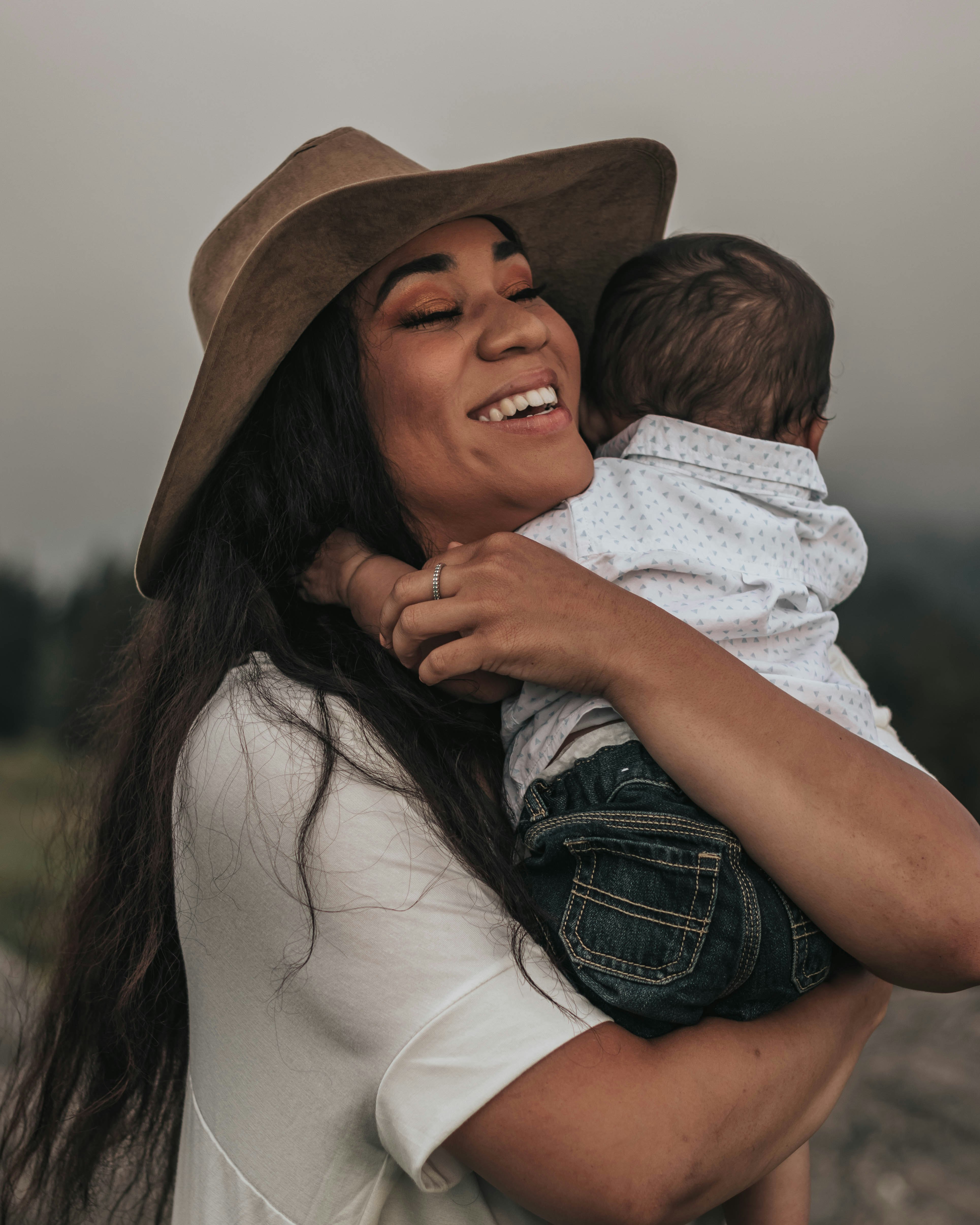 woman hugging baby